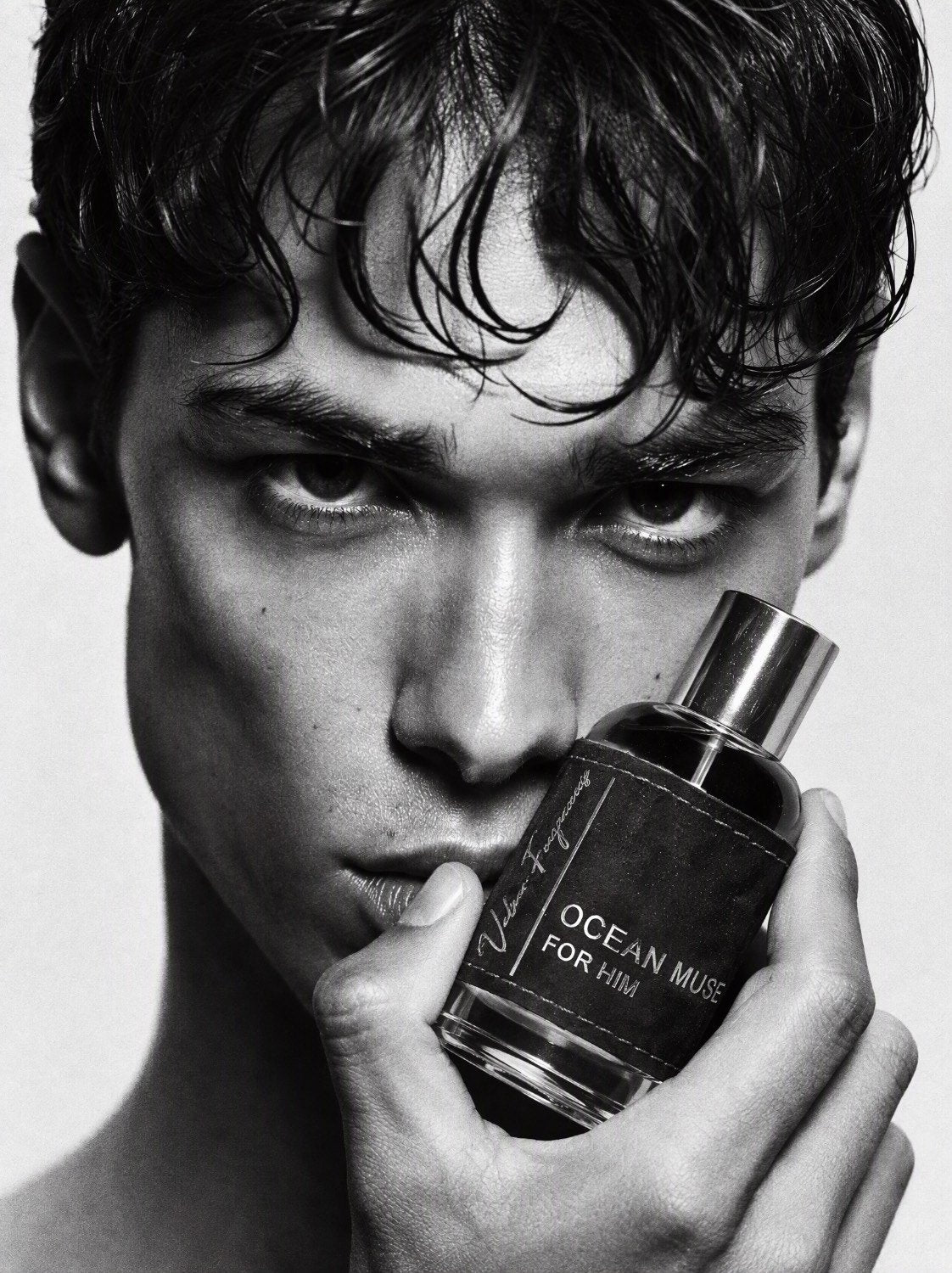 Ocean Muse held to the face — Velour campaign portrait